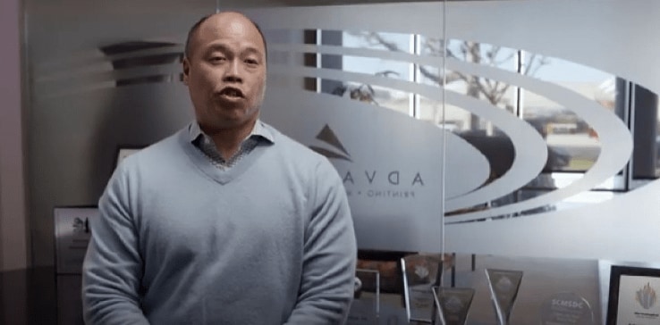 A person in a grey sweater A person in a grey sweater