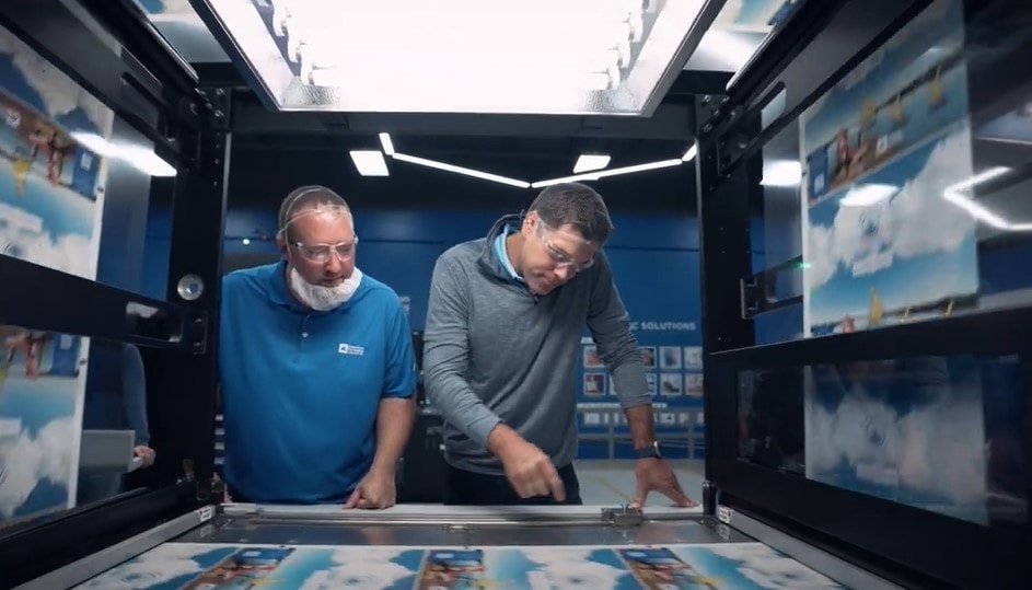 Men looking at a screen in a machine Men looking at a screen in a machine