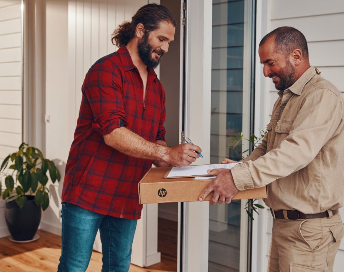 Worker receiving package from delivery service